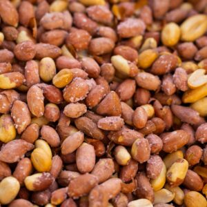 A close-up shot of salted roasted peanuts showcasing texture and seasoning.